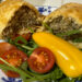 Cumberland sausage roll. Split and served with salad